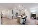 Modern kitchen with an island, stainless steel appliances, and ample cabinet space at 4191 Holstein St, St Cloud, FL 34772