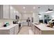 Well-lit kitchen featuring stainless steel appliances, white countertops, and stylish pendant lighting at 4191 Holstein St, St Cloud, FL 34772
