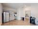 An efficient kitchenette with stainless steel appliances, gray cabinetry, and tiled floors at 4191 Holstein St, St Cloud, FL 34772