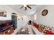 A cozy living room area with carpet, modern furniture, and decor at 4191 Holstein St, St Cloud, FL 34772