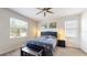 Cozy bedroom with a ceiling fan, comfortable bed, and natural light at 4191 Holstein St, St Cloud, FL 34772
