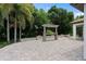 Paved back patio with custom outdoor stone bar, perfect for entertaining and relaxing at 4509 Patricia Ann Ct, Orlando, FL 32839