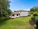 Expansive backyard with a manicured lawn, perfect for outdoor entertaining and relaxation at 4509 Patricia Ann Ct, Orlando, FL 32839