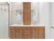 Bathroom featuring a double sink vanity with wood cabinets, marble countertop, and gold hardware at 4509 Patricia Ann Ct, Orlando, FL 32839