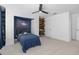 Bedroom with blue accent space, carpet, and a modern ceiling fan at 4509 Patricia Ann Ct, Orlando, FL 32839