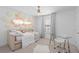Charming bedroom featuring a daybed, desk, and unique wall decor, perfect for a room at 4509 Patricia Ann Ct, Orlando, FL 32839
