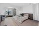 A spacious bedroom boasts neutral tones, pendant lighting, and a designated area for a treadmill and fitness at 4509 Patricia Ann Ct, Orlando, FL 32839