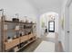 Stylish hallway boasts an archway and modern chandelier, perfect for showcasing decor at 4509 Patricia Ann Ct, Orlando, FL 32839