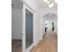 Elegant hallway with light wood floors and views of the home's open concept design at 4509 Patricia Ann Ct, Orlando, FL 32839