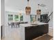 Bright open-concept layout with kitchen island, dining area, and comfortable living space at 4509 Patricia Ann Ct, Orlando, FL 32839