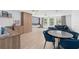 Open concept living room with dining area, movie screen and built in storage at 4509 Patricia Ann Ct, Orlando, FL 32839