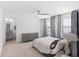 Stylish main bedroom featuring a luxurious bed, neutral decor, and an en-suite bathroom in view at 4509 Patricia Ann Ct, Orlando, FL 32839