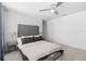 Cozy main bedroom featuring a comfortable bed, side tables, and soft carpeting for a relaxing retreat at 4509 Patricia Ann Ct, Orlando, FL 32839