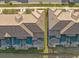 An aerial shot shows townhome rooftops and inviting back patios, some featuring private pools for relaxation at 4918 Windermere Ave, Kissimmee, FL 34746