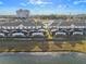 Aerial view of townhomes with screened-in patios overlooking the backyard, showcasing community layout at 4918 Windermere Ave, Kissimmee, FL 34746