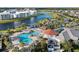 Aerial view highlighting the community's pool, cabana, and scenic waterfront amenities for leisure and social gatherings at 4918 Windermere Ave, Kissimmee, FL 34746