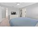 Cozy bedroom with neutral walls, carpet and television at 4918 Windermere Ave, Kissimmee, FL 34746