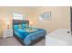 Cozy bedroom featuring a gray bed with Minion-themed bedding and a white dresser at 4918 Windermere Ave, Kissimmee, FL 34746