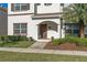 Charming two-story townhome with well-maintained landscaping at 4918 Windermere Ave, Kissimmee, FL 34746