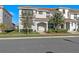 Inviting townhome with lush landscaping and covered entrance at 4918 Windermere Ave, Kissimmee, FL 34746