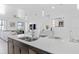 Modern kitchen featuring white quartz countertops and stainless steel appliances at 4918 Windermere Ave, Kissimmee, FL 34746