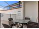Covered patio featuring a dining table with seating for four, perfect for outdoor entertaining at 4918 Windermere Ave, Kissimmee, FL 34746