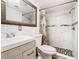 Modern bathroom showcasing white marble-style tile, a stylish vanity, and a mosaic-tiled shower floor at 5050 Howison Rd, Kissimmee, FL 34746