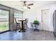 Bright dining area with tile flooring and a ceiling fan, creating a welcoming space for gatherings at 5050 Howison Rd, Kissimmee, FL 34746