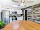 Bright kitchen with stainless steel appliances, white cabinets, and a stylish mosaic backsplash at 5050 Howison Rd, Kissimmee, FL 34746