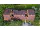 Aerial view of the apartment complex featuring red tile roofs, landscaping, and convenient parking at 5283 Images Cir # 308, Kissimmee, FL 34746