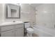 Bathroom featuring a tub, shower, single vanity, and framed mirror, blending functionality with style at 5283 Images Cir # 308, Kissimmee, FL 34746