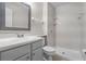 Well-lit bathroom with a shower, modern fixtures, vanity, and large mirror for a refreshing start at 5283 Images Cir # 308, Kissimmee, FL 34746