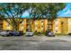 Inviting apartment building with mature trees and well-maintained grounds and convenient parking at 5283 Images Cir # 308, Kissimmee, FL 34746