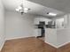 Kitchen and breakfast bar with stainless steel appliances and ample counter space at 5283 Images Cir # 308, Kissimmee, FL 34746