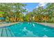 Sparkling community pool with lounge chairs, perfect for relaxation and enjoyment at 5283 Images Cir # 308, Kissimmee, FL 34746