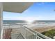 Charming condo balcony with calming ocean views and relaxing seating at 5301 S Atlantic Ave # 51, New Smyrna Beach, FL 32169