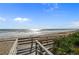 Wooden boardwalk providing access to the beach and ocean views at 5301 S Atlantic Ave # 51, New Smyrna Beach, FL 32169