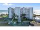 Stylish oceanfront condo building with lush landscaping and ample parking at 5301 S Atlantic Ave # 51, New Smyrna Beach, FL 32169