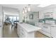 Spacious kitchen open to living area with white cabinetry and ample counter space at 5301 S Atlantic Ave # 51, New Smyrna Beach, FL 32169