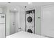 Convenient stacked washer and dryer in a closet at 5301 S Atlantic Ave # 51, New Smyrna Beach, FL 32169