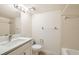 This bathroom includes a large sink and vanity, standard toilet and shower/bath combo at 5321 Vineland Rd # 101, Orlando, FL 32811