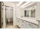 The bathroom is well lit and includes a modern vanity, sink, toilet, and updated tile at 5321 Vineland Rd # 101, Orlando, FL 32811