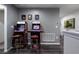 Game room featuring classic arcade games and bar stool seating at 555 Meadow Bend Dr, Davenport, FL 33837