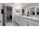 Bathroom with double sinks, modern fixtures and plenty of counter space at 555 Meadow Bend Dr, Davenport, FL 33837