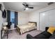 Cozy bedroom showcasing a window for natural light, a bed, and seating area at 555 Meadow Bend Dr, Davenport, FL 33837
