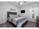 Inviting bedroom with a bed, neutral decor, carpeted floor, a ceiling fan, and a window with natural light at 555 Meadow Bend Dr, Davenport, FL 33837