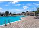 Large community pool with a fountain, lounge seating, and a covered picnic area with tables and chairs at 555 Meadow Bend Dr, Davenport, FL 33837
