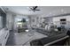 Open concept living room with comfortable seating, a ceiling fan, neutral tones, and natural light at 555 Meadow Bend Dr, Davenport, FL 33837