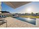 Relax by the pool, complete with lounge chairs and patio seating, with an umbrella for sunny days at 555 Meadow Bend Dr, Davenport, FL 33837