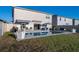 Backyard features a beautiful in-ground pool, a covered patio and outdoor seating at 555 Meadow Bend Dr, Davenport, FL 33837